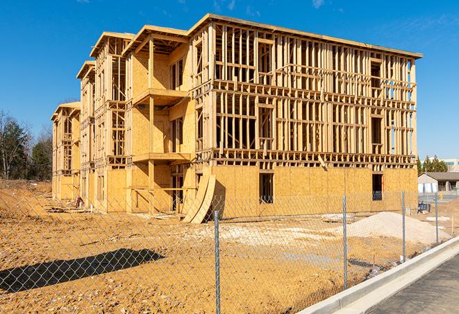 a job site enclosed by temporary chain link fences, ensuring safety for workers and pedestrians in San Mateo